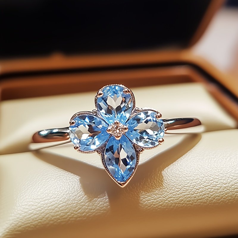 Ceres Ring in sterling silver with natural topaz